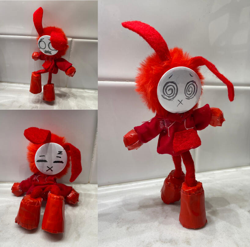 Ethyl the art doll rabbit. He has a swapable button face.